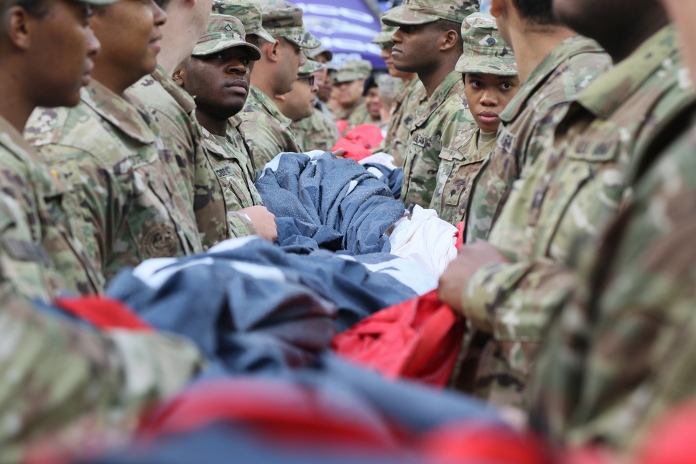 Maryland National Guard Soldiers and Airmen display flag at Baltimore Ravens Game