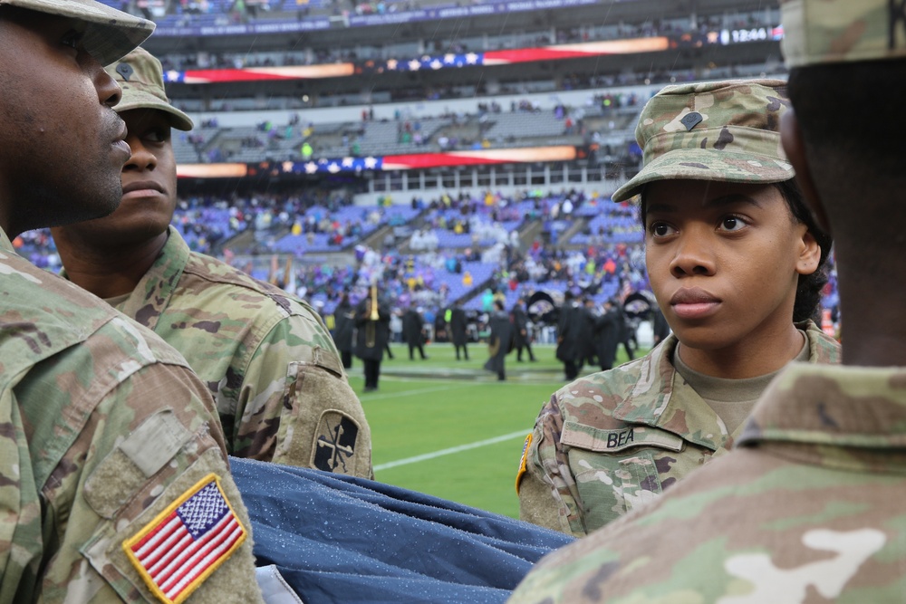 Maryland National Guard Soldiers and Airmen display flag at Baltimore Ravens Game