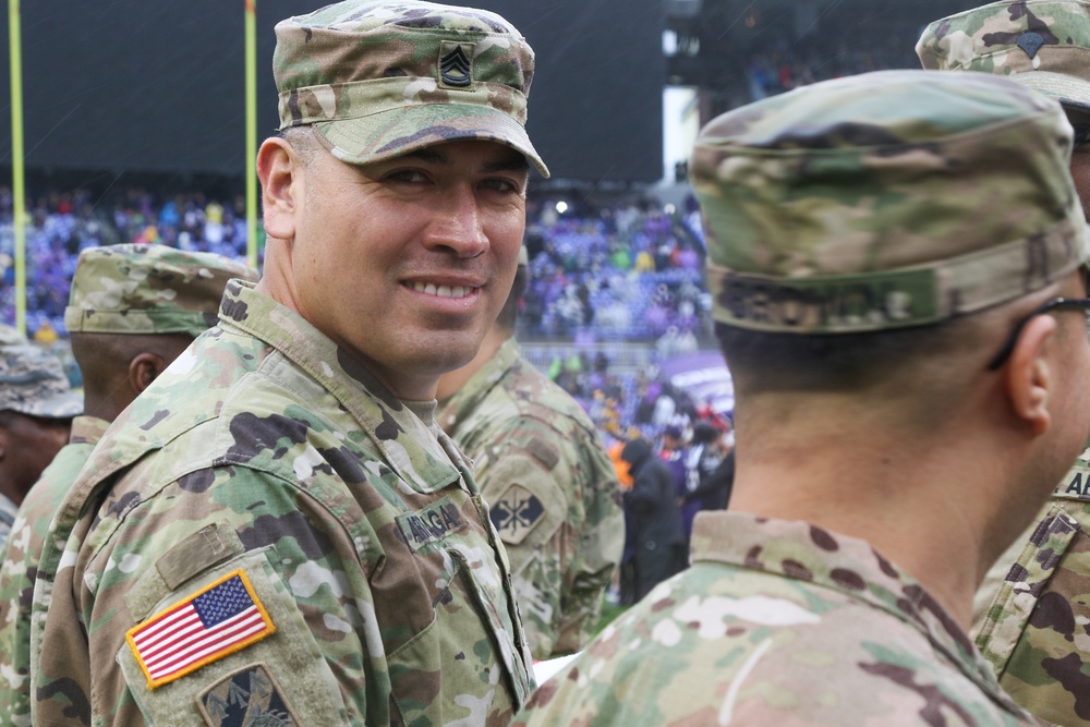 Maryland National Guard Soldiers and Airmen display flag at Baltimore Ravens Game