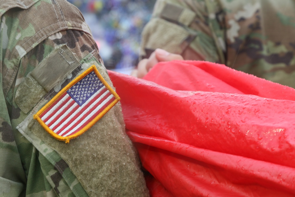 Maryland National Guard Soldiers and Airmen display flag at Baltimore Ravens Game