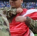 Maryland National Guard Soldiers and Airmen display flag at Baltimore Ravens Game