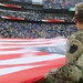 Maryland National Guard Soldiers and Airmen display flag at Baltimore Ravens Game