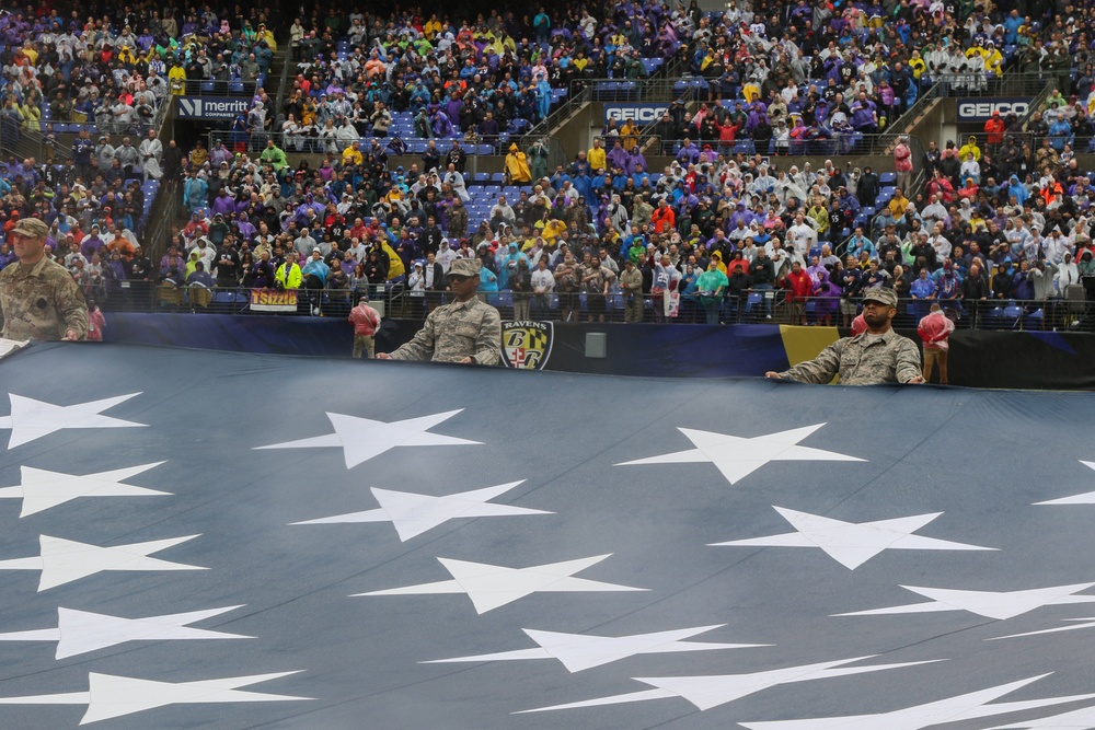 Maryland National Guard Soldiers and Airmen display flag at Baltimore Ravens Game