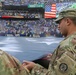 Maryland National Guard Soldiers and Airmen display flag at Baltimore Ravens Game