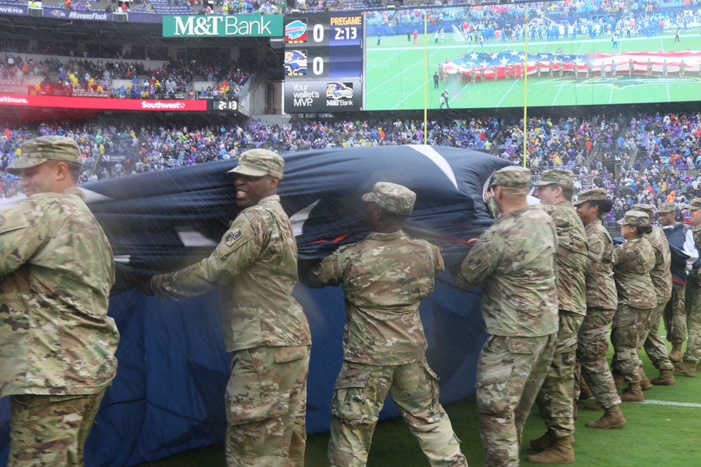 Maryland National Guard Soldiers and Airmen display flag at Baltimore Ravens Game