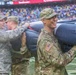 Maryland National Guard Soldiers and Airmen display flag at Baltimore Ravens Game