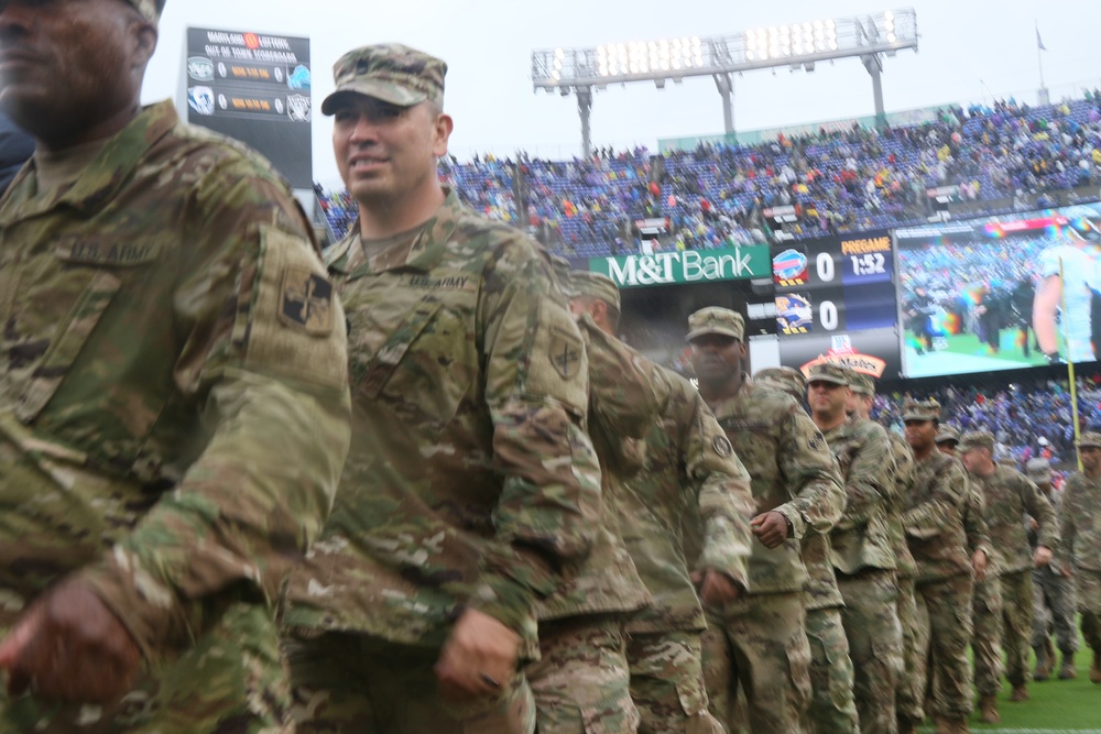 Maryland National Guard Soldiers and Airmen display flag at Baltimore Ravens Game