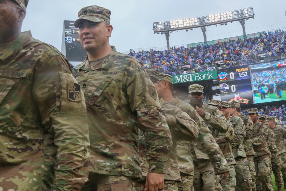 Maryland National Guard Soldiers and Airmen display flag at Baltimore Ravens Game