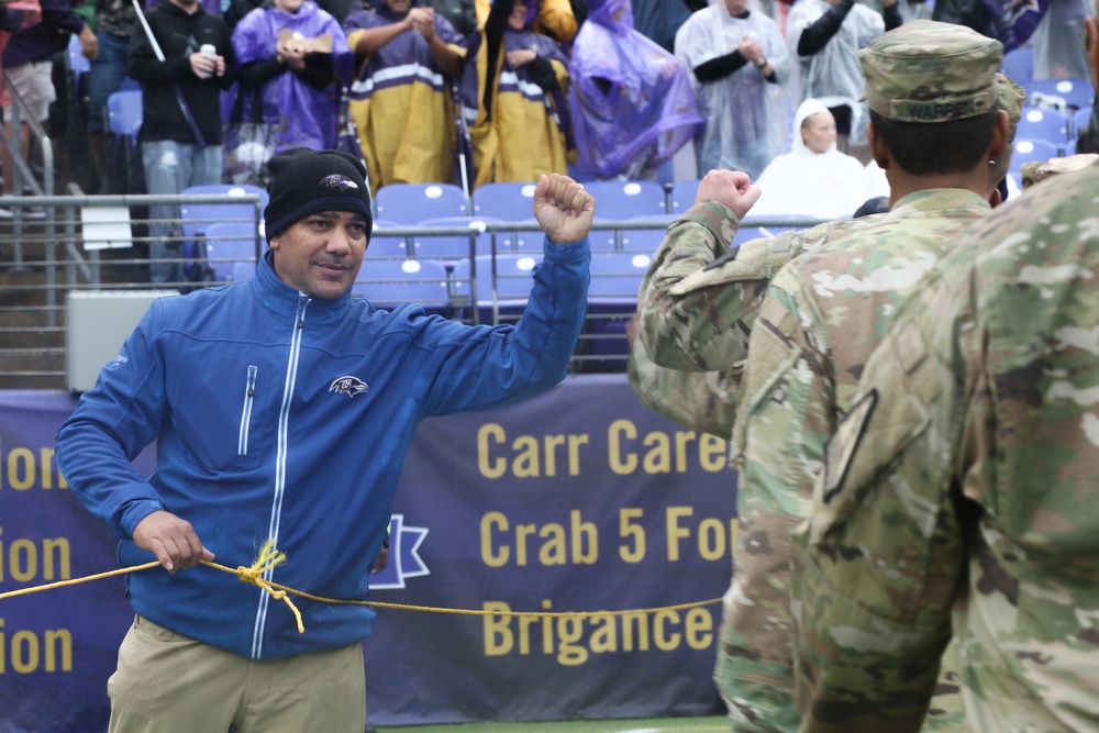 Maryland National Guard Soldiers and Airmen display flag at Baltimore Ravens Game