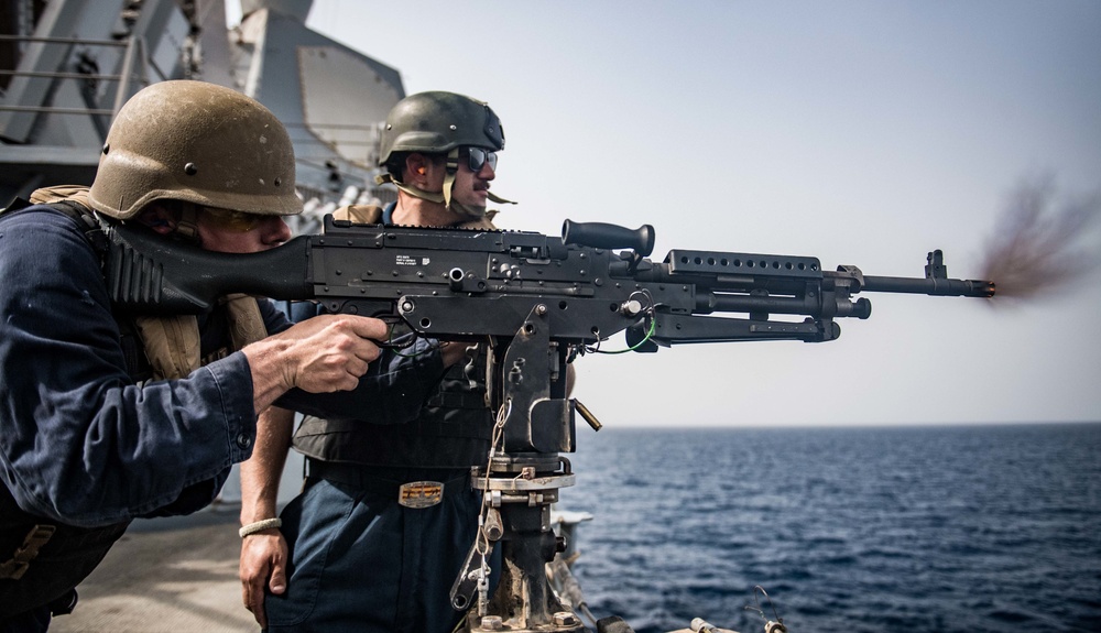 Sailor shoot M240B machine gun on USS Jason Dunham (DDG 109)