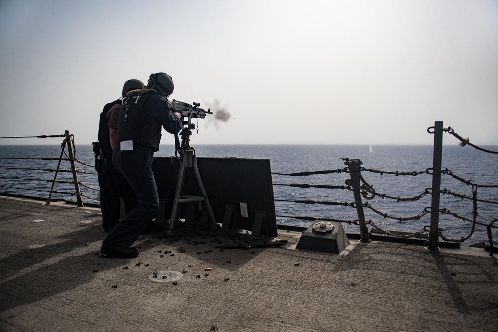 Sailor shoot M240B machine gun on USS Jason Dunham (DDG 109)