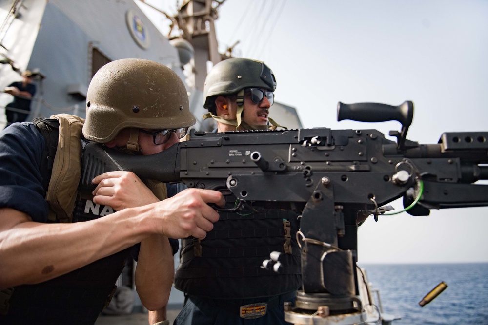 Sailor shoot M240B machine gun on USS Jason Dunham (DDG 109)