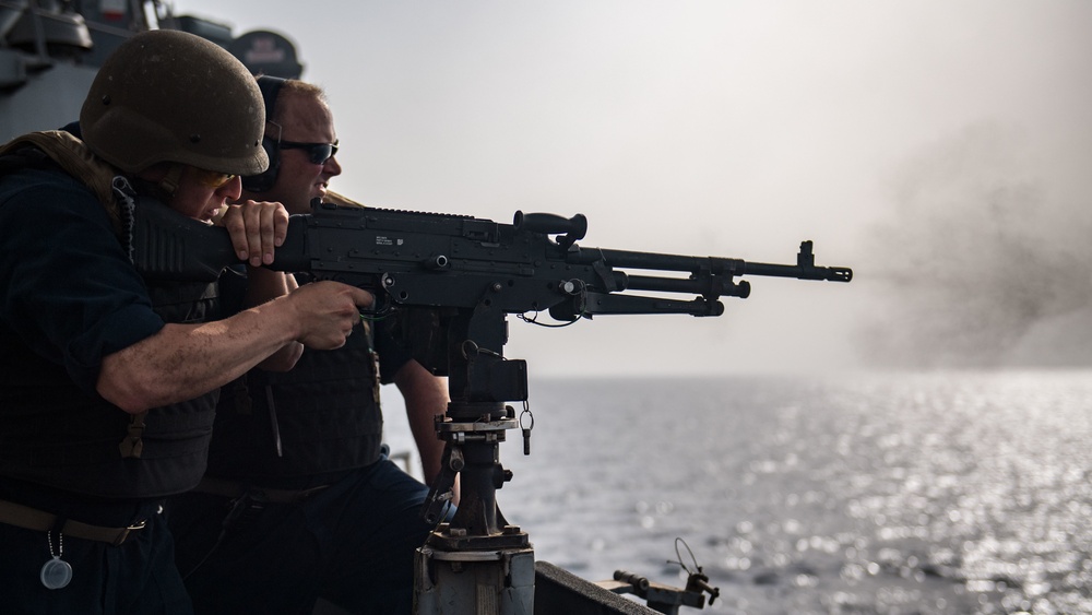 Sailor shoot M240B machine gun on USS Jason Dunham (DDG 109)