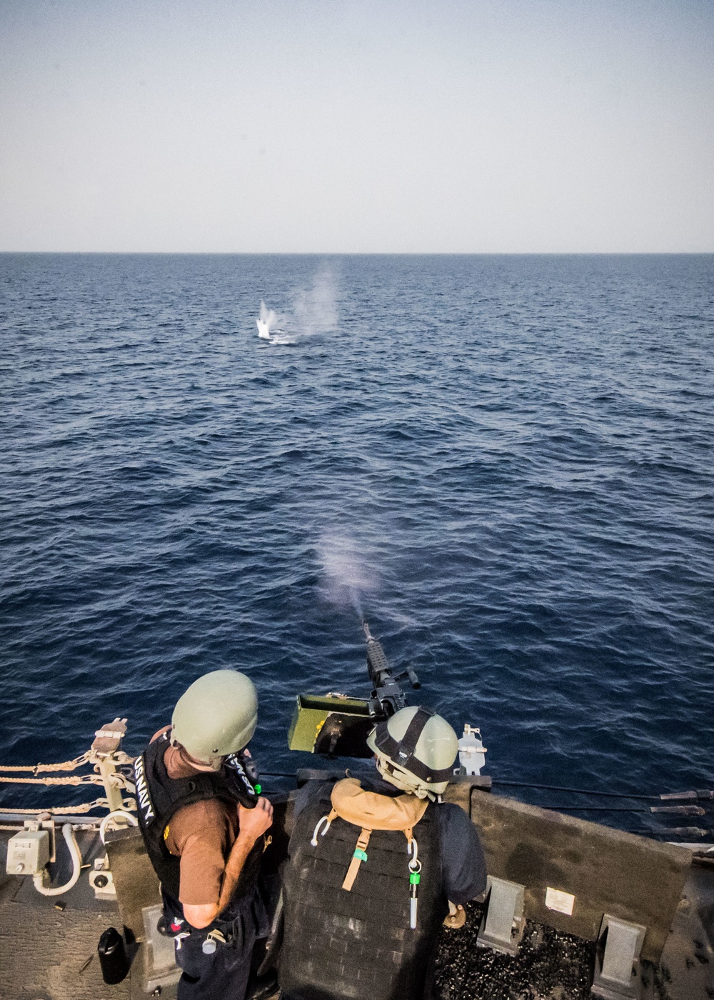 Sailor shoot M240B machine gun on USS Jason Dunham (DDG 109)