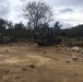 Marines and Navy Seabees clear debris on Tinian