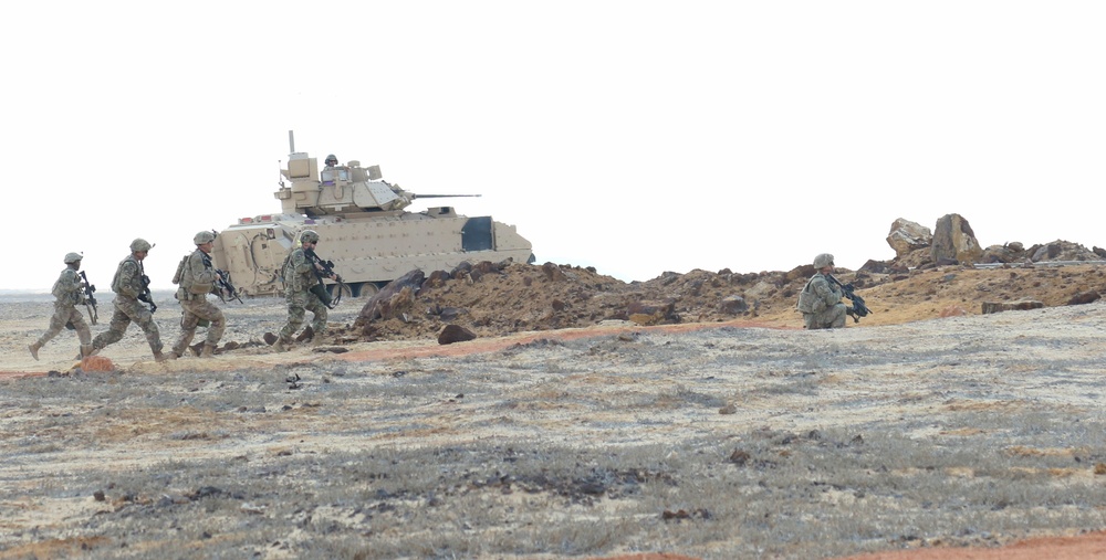 Task Force Spartan Soldiers work together during Combined Arms Live Exercise rehearsal