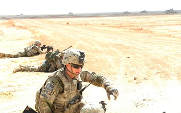 Task Force Spartan Soldiers work together during Combined Arms Live Exercise rehearsal