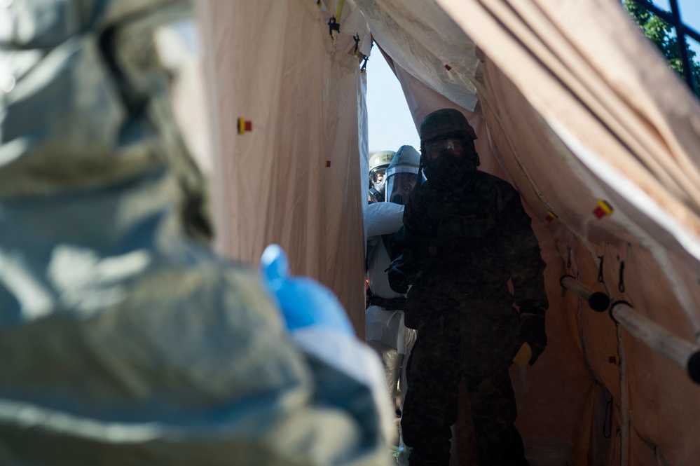 Airmen simulate patient decontamination during base readiness exercise