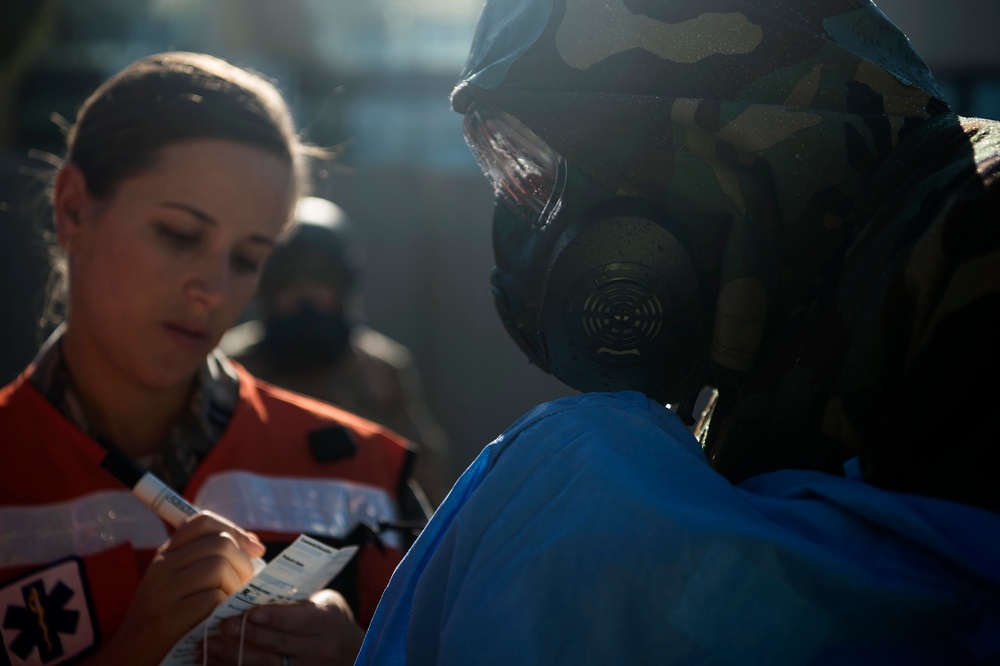 Airmen simulate patient decontamination during base readiness exercise