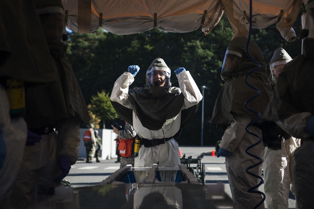 Airmen simulate patient decontamination during base readiness exercise