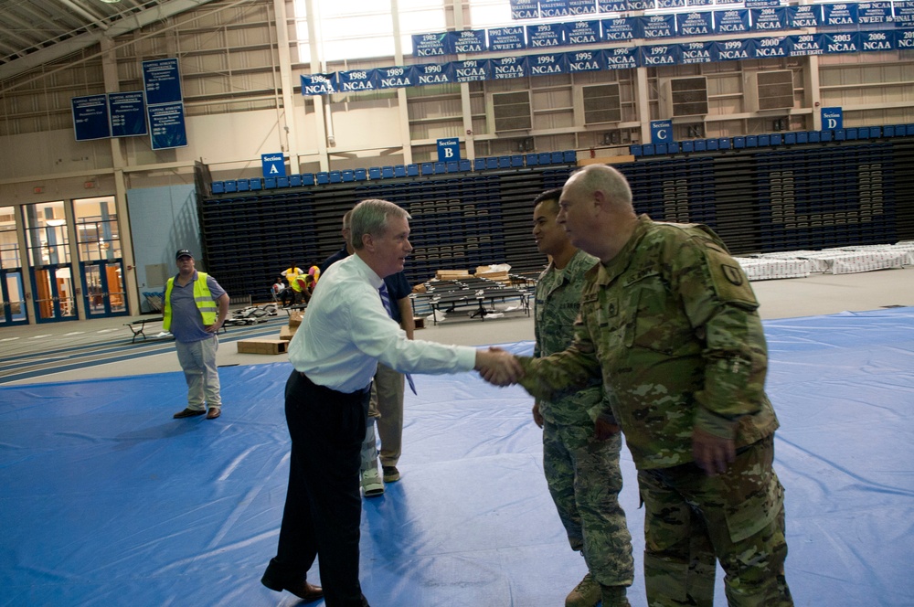 VNG personnel assist setting up state-managed shelters