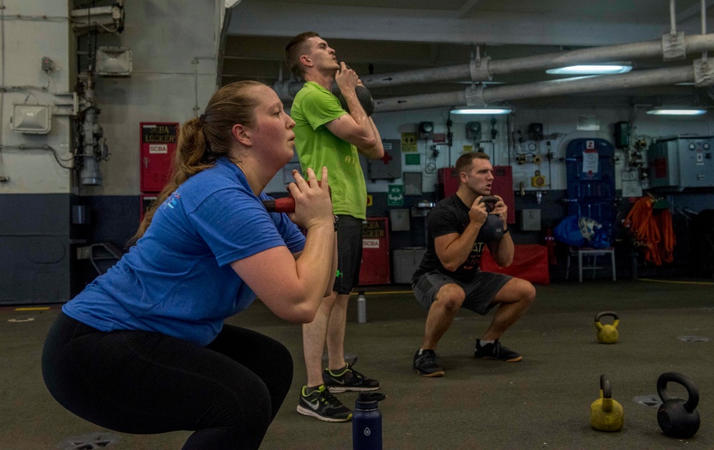 Sailors participate in High-Intensity Interval Training aboard GHWB