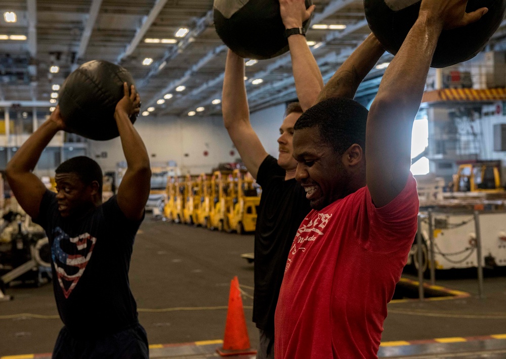 Sailors participate in High-Intensity Interval Training aboard GHWB