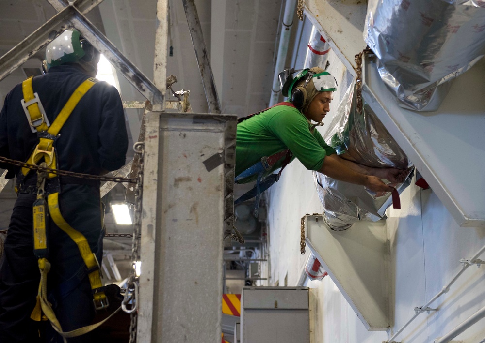 Sailors Wrap Catapult Steam Pistons