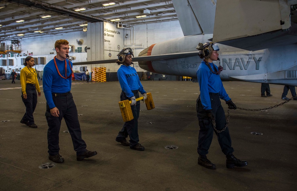 Sailors Practice Manuvering Aircraft