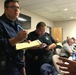Coast Guard first responders meet with Emergency Operations Center members