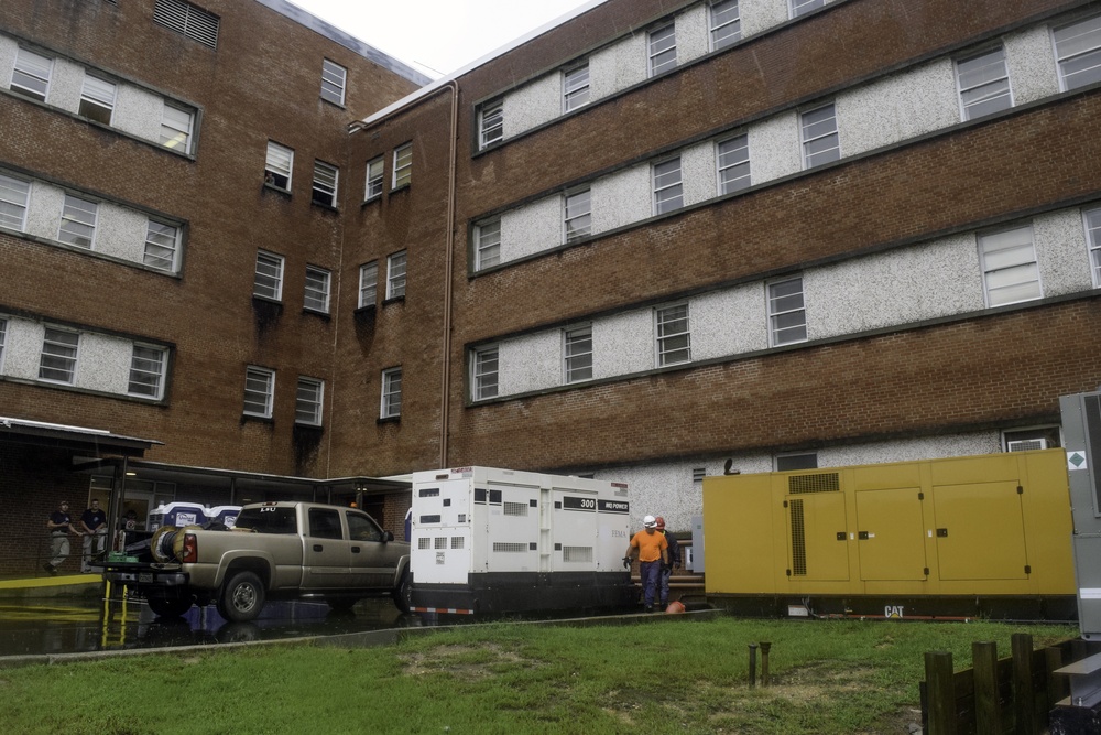 Corps contractors install temporary power to a section of Cherry Hospital in Goldsboro, North Carolina