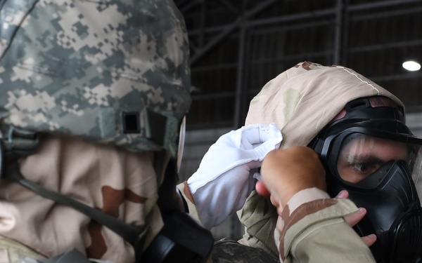 Donning MOPP gear