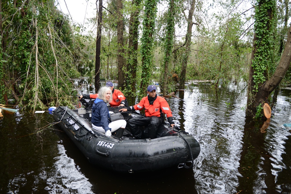 Coast Guard rescues woman and husband from floods