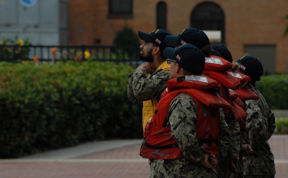 Crew members from the USS Oscar Austin (DDG-79) await the arrival of the ARC Gloria in Downtown Norfolk, Virginia