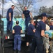 Coast Guard personnel distribute bottled water