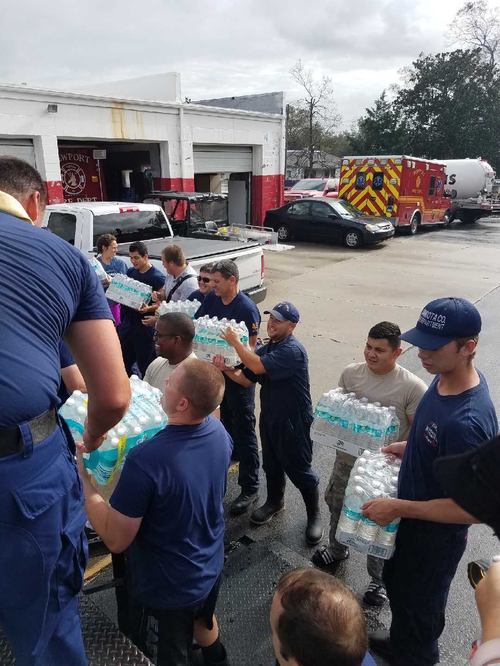 Coast Guard personnel distribute bottled water