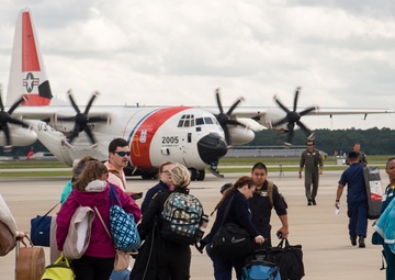 Coast Guard HC-130 Hercules aircrew transports stranded medical personnel to work at an operational hospital in Wilmington
