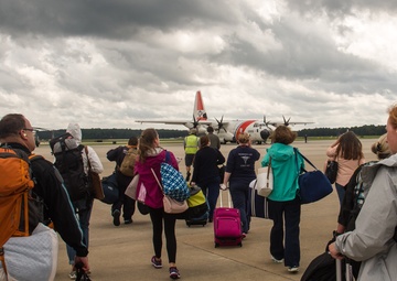 Coast Guard HC-130 Hercules aircrew transports stranded medical personnel to work at an operational hospital in Wilmington