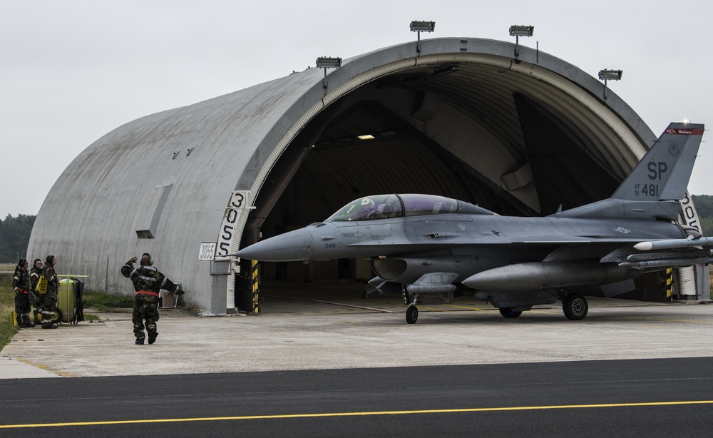 Airmen de-arm F-16 during base readiness exercise