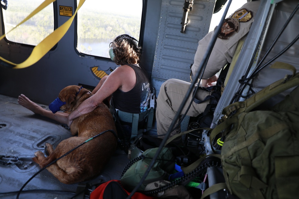 CBP AMO flight crew rescue two adults and a dog from Hurricane Florence flood waters