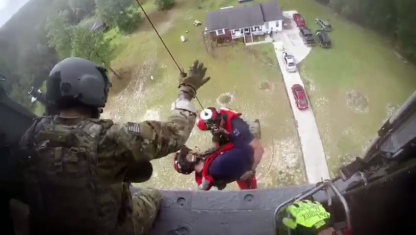 Members of 106th Rescue Squadron go in for the save during Hurricane Florence
