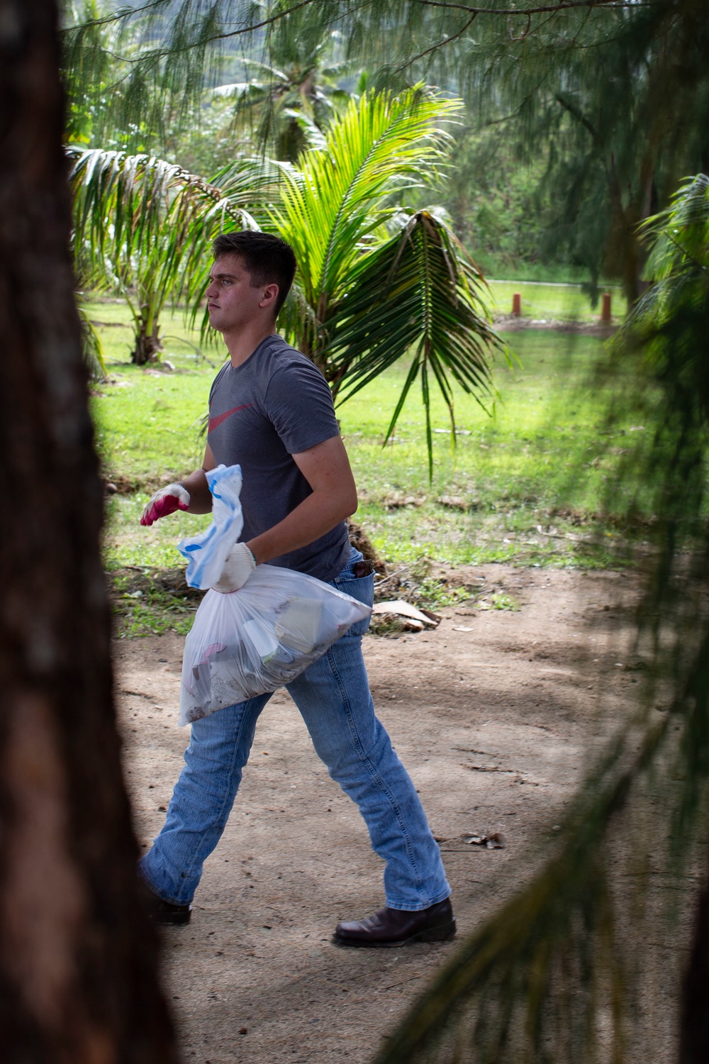 Marine Aircraft Group 12 cleans Agat beach where Marines landed 74 years ago