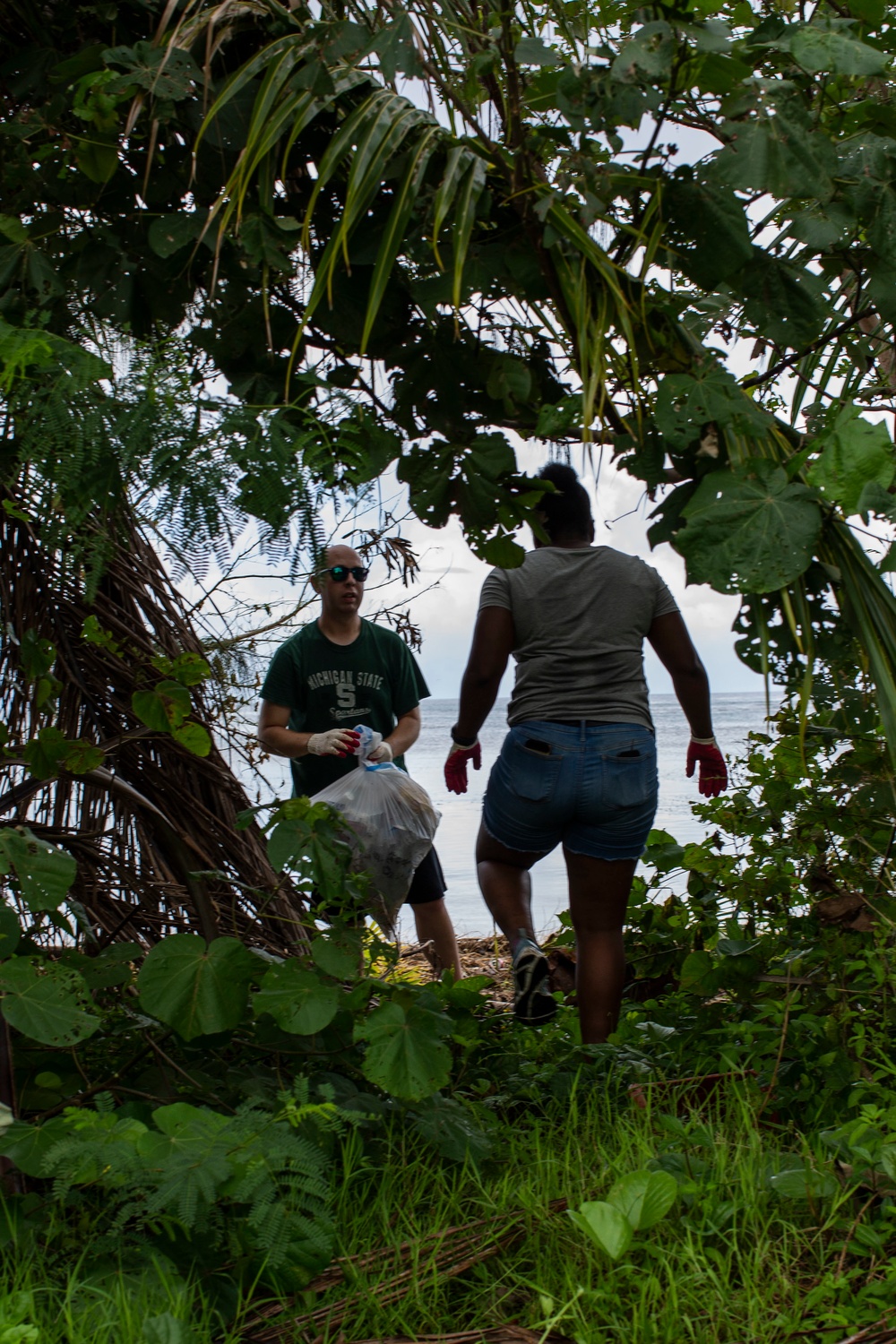 Marine Aircraft Group 12 cleans Agat beach where Marines landed 74 years ago