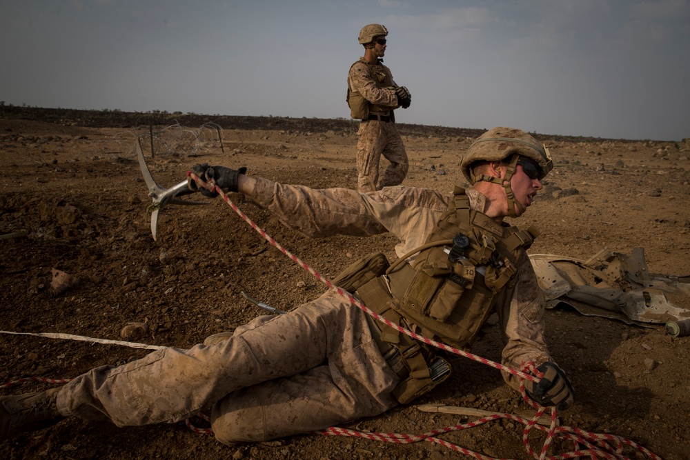 Marines breach through obstacles with bangalores