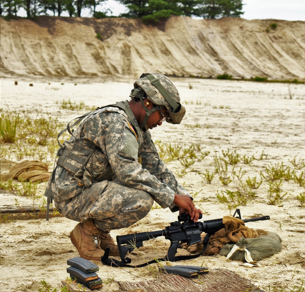 Soldier adjust weapon during Qualification Range Preparation