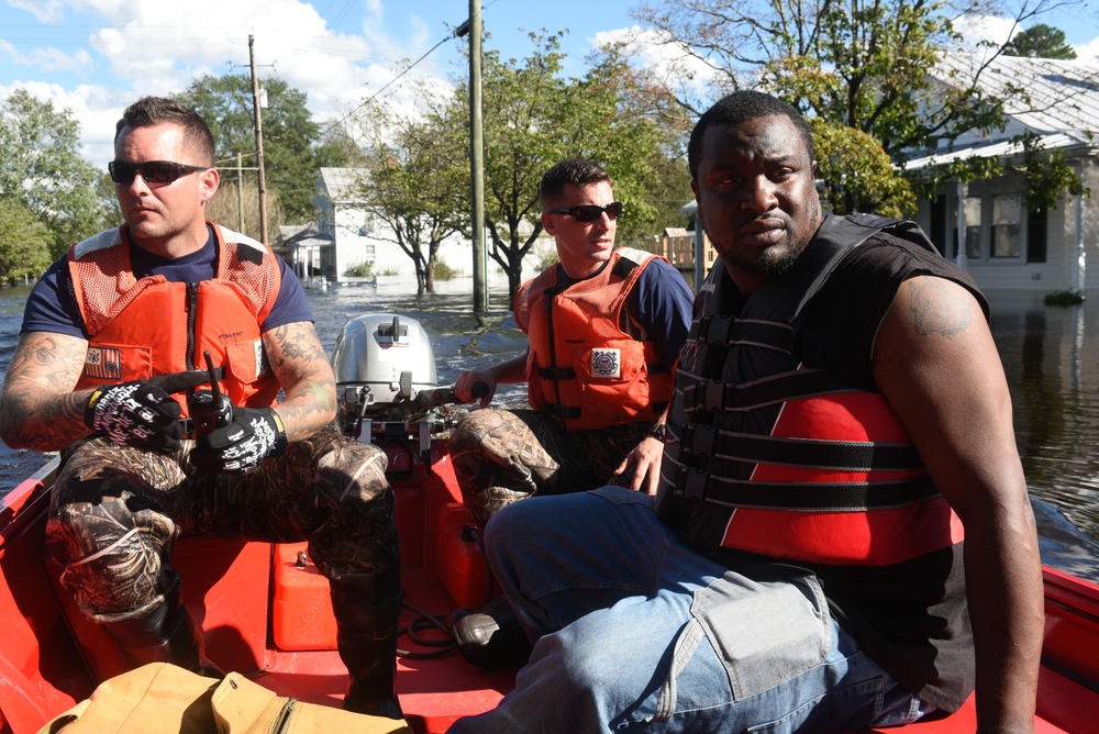 Coast Guard crews rescue dogs, assist new father