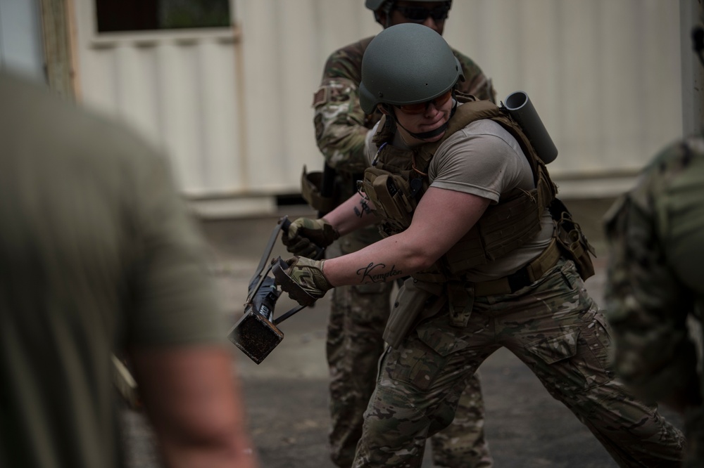 Security Forces Airmen conduct breaching and clearing training