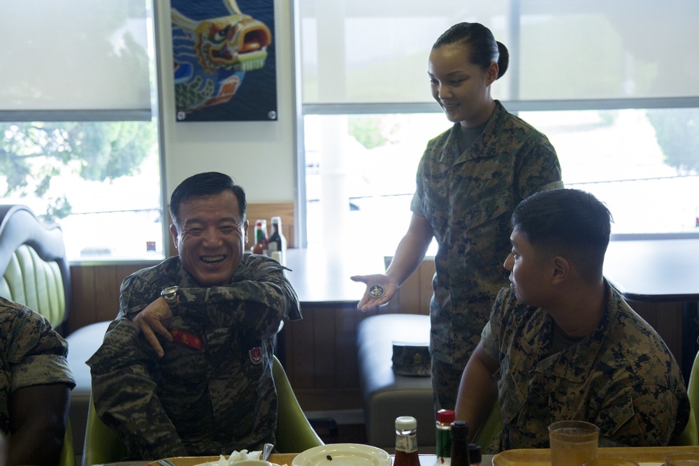 Marines break bread with the Sgt. Maj. of the Republic of Korea Marines