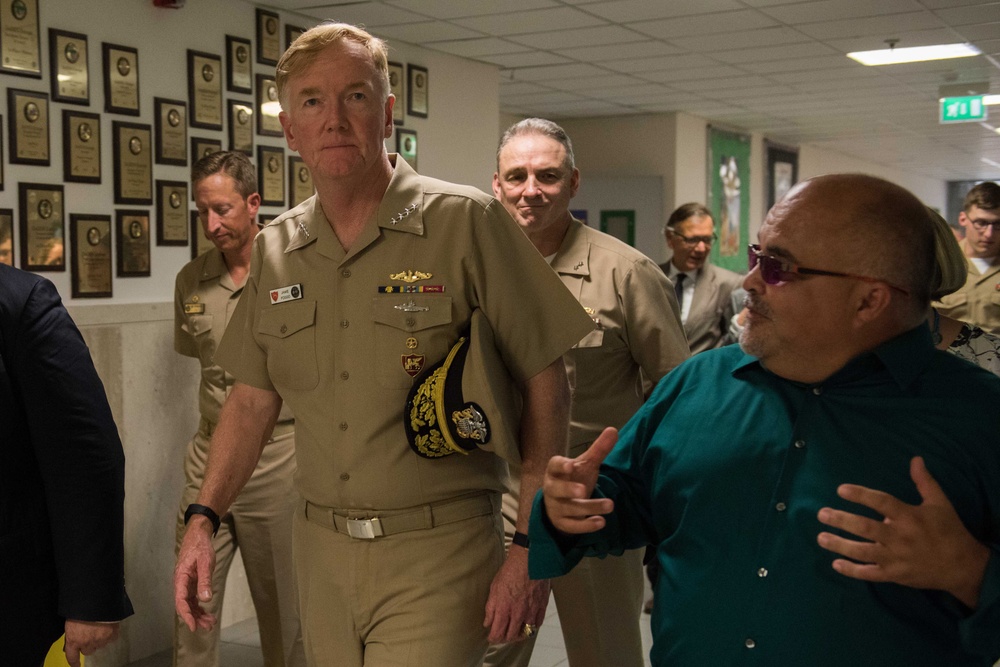 Naples Middle High School Principal gives tour to Adm. James G. Foggo III