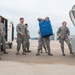 Airmen unload luggage after arriving at Ramstein AB